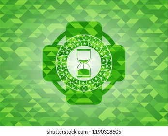 sand clock icon inside realistic green emblem. Mosaic background