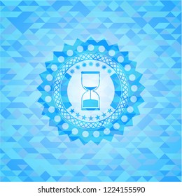 sand clock icon inside realistic sky blue emblem. Mosaic background