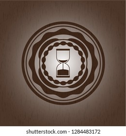 sand clock icon inside realistic wooden emblem