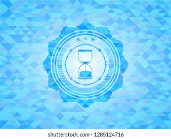 sand clock icon inside realistic light blue emblem. Mosaic background