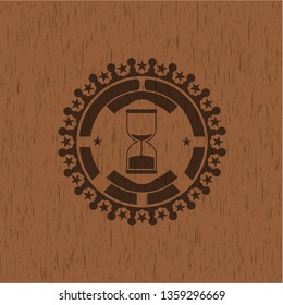 sand clock icon inside realistic wood emblem