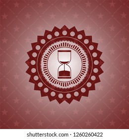 sand clock icon inside red emblem