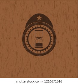 sand clock icon inside retro style wood emblem