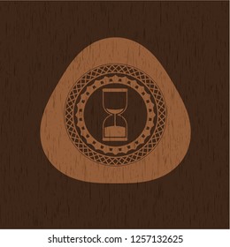 sand clock icon inside retro style wooden emblem