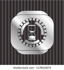 sand clock icon inside silver shiny emblem