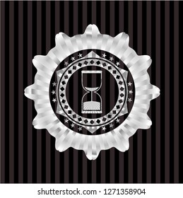 sand clock icon inside silver shiny emblem