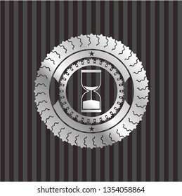 sand clock icon inside silvery badge