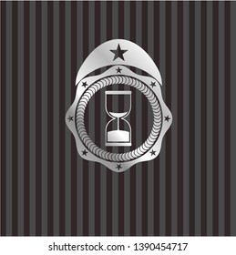sand clock icon inside silvery shiny emblem