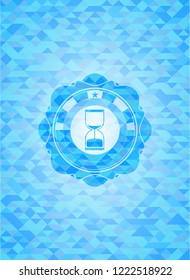 sand clock icon inside sky blue emblem with mosaic ecological style background
