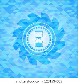 sand clock icon inside sky blue emblem. Mosaic background