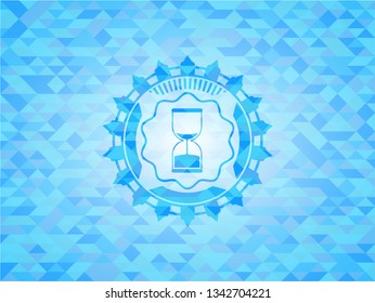sand clock icon inside sky blue emblem with triangle mosaic background
