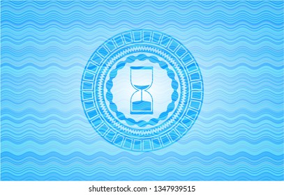 sand clock icon inside sky blue water emblem background.