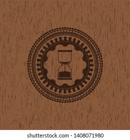 sand clock icon inside vintage wooden emblem
