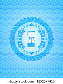 sand clock icon inside water badge.