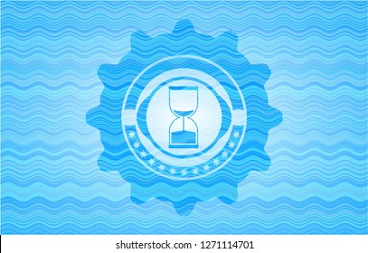 sand clock icon inside water wave style badge.