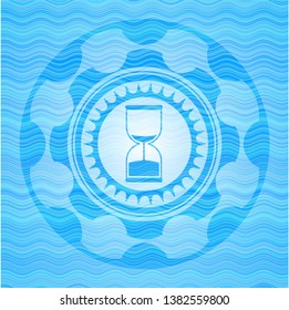 sand clock icon inside water style badge.