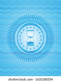 sand clock icon inside water concept style emblem.