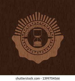 sand clock icon inside wood emblem. Vintage.