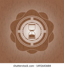 sand clock icon inside wood badge or emblem