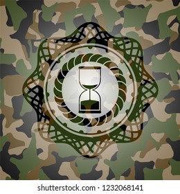 sand clock icon on camouflage texture