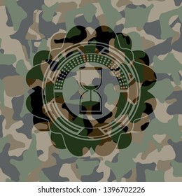 sand clock icon on camouflage texture