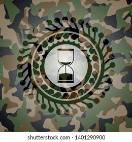 sand clock icon on camouflage texture