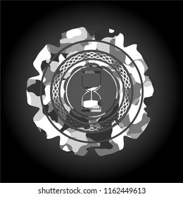 sand clock icon on grey camouflaged pattern