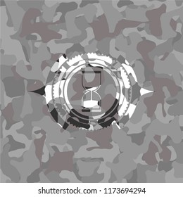 sand clock icon on grey camouflaged pattern