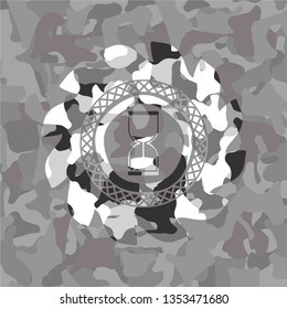sand clock icon on grey camo pattern