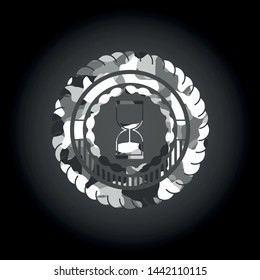 sand clock icon on grey camouflage texture