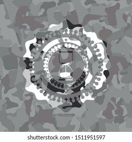 sand clock icon on grey camo pattern