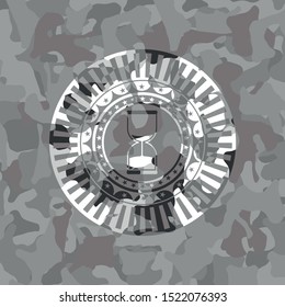 sand clock icon on grey camo pattern