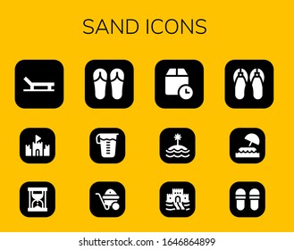 sand icon set. 12 filled sand icons. Included Beach, Sand castle, Hourglass, Sandals, Measuring glass, Wheelbarrow, Wait time, Island, Slippers icons