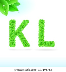 Sans serif font with green leaf decoration on white background. K and L letters