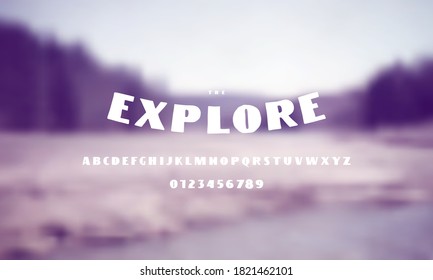 Sans serif font in the style of handmade graphic. Letters and numbers for emblem and logo design. White print on blurred background