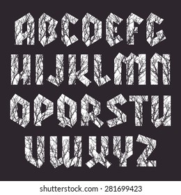 Sanserif blackletter font with texture of the branches. White font on black background