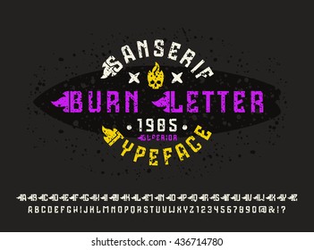 Sanserif font with flame initial letter and spray texture. Typeface design for t-shirt. Color print on black background