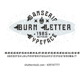 Sanserif font with flame initial letter and spray texture. Typeface design for t-shirt. Black font on light background