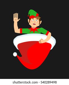 Santa cap and elf. Little Claus assistant. Christmas red hat