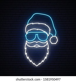 Santa Claus in a blue hat and sunglasses in neon style. Christmas neon vector illustration.