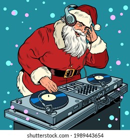 Santa Claus Christmas dj on vinyl turntables. concert music performance