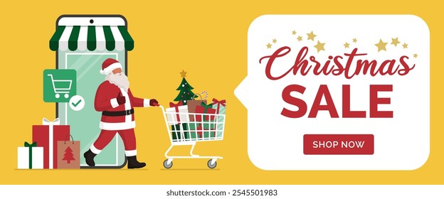 Santa Claus doing online shopping at Christmas, he is walking out of a virtual store in a mobile app on smartphone and pushing a trolley full of Christmas gifts and decorations, banner with copy space