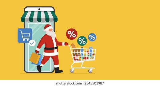 Papai Noel fazendo compras on-line no Natal, ele está saindo de um supermercado virtual em um aplicativo móvel no smartphone e empurrando um carrinho de compras completo com mantimentos, copiar espaço