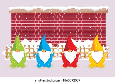 Santa Claus dwarf poses in front of a snow-covered wall and wooden fence