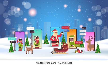 santa claus with elves helpers using chatting app social network communication new year christmas holidays celebration concept smartphone screen online mobile application portrait horizontal vector