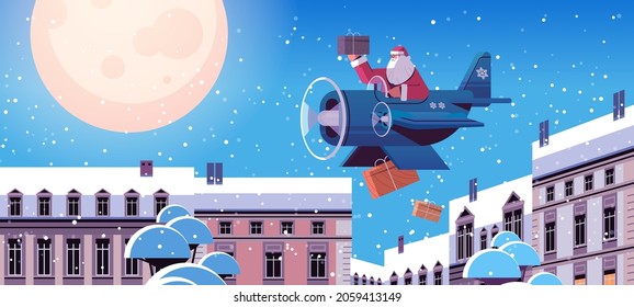 santa claus flying airplane with gifts merry christmas happy new year winter holidays celebration concept