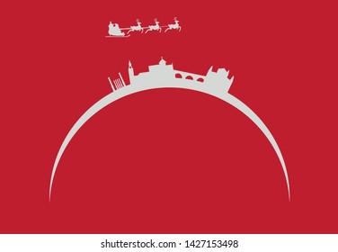 Santa Claus flying over city skyline of Cordoba in Spain