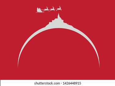 Santa Claus flying over skyline of Abbey of Mont Saint-Michel in France