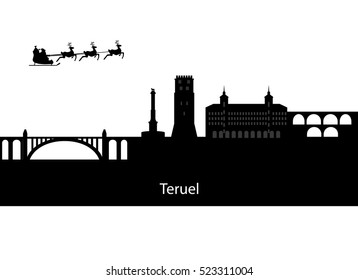 Santa claus flying over skyline of teruel in spain