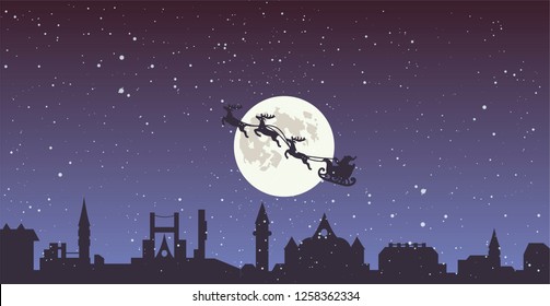 santa claus flying over town in the sleight with reindeers at christmas night vector illystration . nights sky, full moon and snowfall